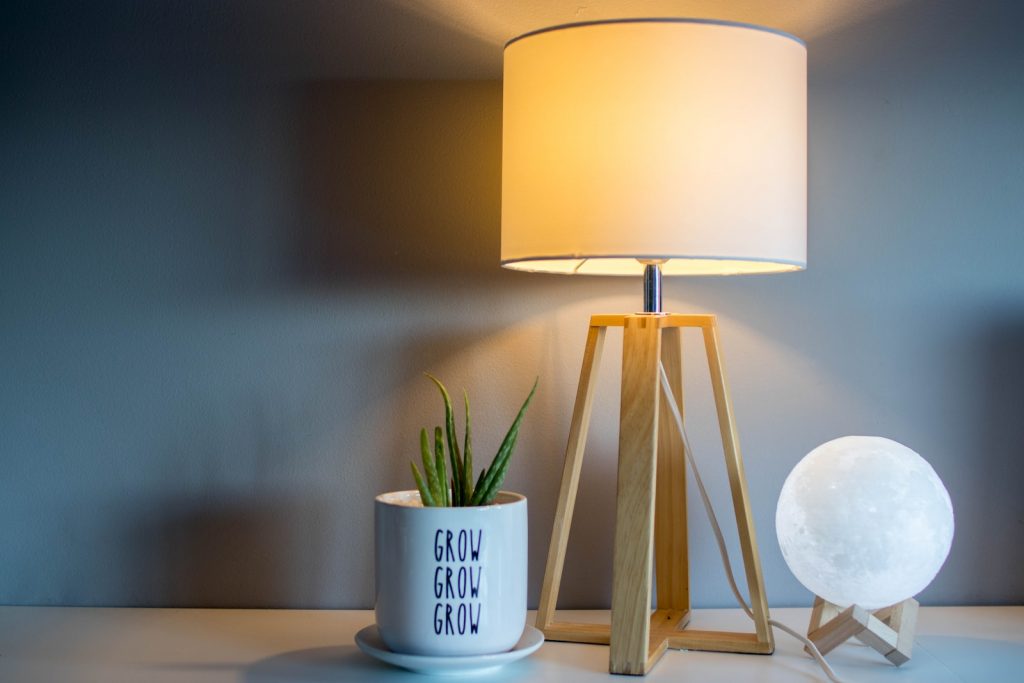 brown and white table lamp with light